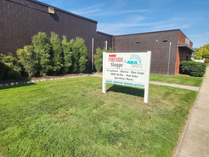 The Fireside Shoppe & Aqua Mist storefront and yard sign at 18714 Quarry Road in Riverview