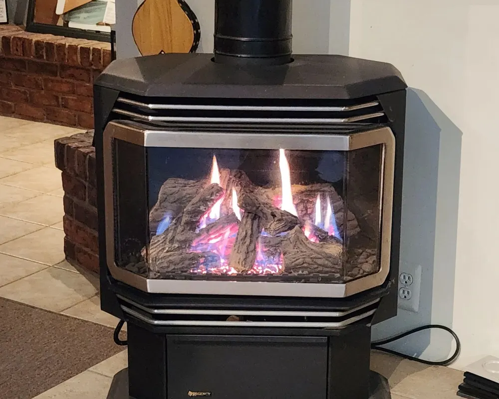 A freestanding gas stove burning